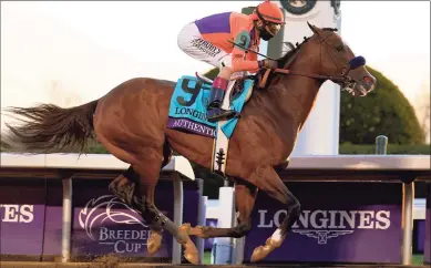  ?? Michael Conroy / Associated Press ?? John Velazquez rides Authentic to win the Breeders’ Cup Classic Saturday in Lexington, Ky.