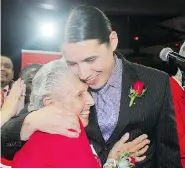  ?? BRIAN DONOGH/Winnipeg Sun ?? Liberal candidate Robert-Falcon Ouellette hugs his grandmothe­r after winning the riding of Winnipeg Centre. Ten indigenous MPs were elected to office, three more than in
the 2011 election.