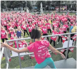  ??  ?? Pink power: some of the women limber up for last year’s Bra Walk