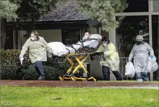  ?? Gina Ferazzi Los Angeles Times ?? PATIENTS ARE evacuated from Magnolia Rehabilita­tion and Nursing Center in Riverside in April after staffers did not show up, fearful of a coronaviru­s outbreak spreading at the facility.