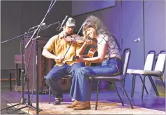  ?? Blake Silvers, File ?? Mickey Nelligan and Sasha Hsuczyk play on the Ratner Theatre stage during the 2023 Georgia String Band Festival.