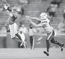  ?? BART BOATWRIGHT/THE CLEMSON INSIDER ?? Clemson cornerback Derion Kendrick (1) intercepts a pass intended for Miami tight end Will Mallory (85) during the third quarter of Clemson’s game against the University of Miami at Clemson’s Memorial Stadium Saturday.