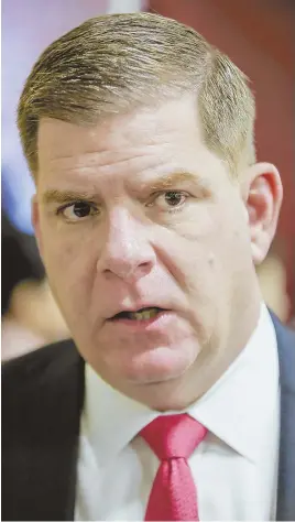  ??  ?? ‘KEEPING THE PUBLIC SAFE’: Boston Mayor Martin J. Walsh responds to a Herald report showing a hike in overtime pay.