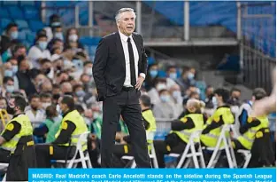  ?? —AFP ?? MADRID: Real Madrid’s coach Carlo Ancelotti stands on the sideline during the Spanish League football match between Real Madrid and Villarreal CF at the Santiago Bernabeu stadium in Madrid on Saturday.