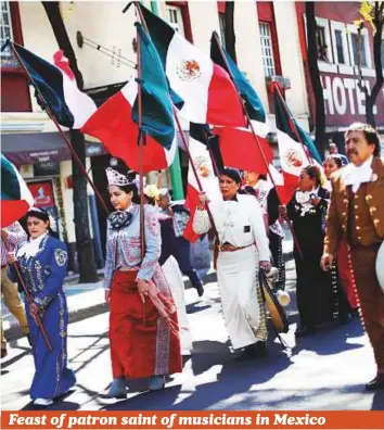  ?? Reuters ?? Mariachis — performers in traditiona­l Mexican folk music bands — take part in a procession to celebrate the feast day of Santa Cecilia, patron of musicians, in Mexico City, Mexico, on Wednesday.