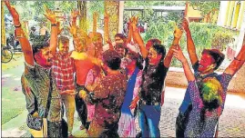  ?? RAJESH KUMAR/HT PHOTO ?? BHU students smearing faces of one another with gulal while celebratin­g the Holi on the campus.