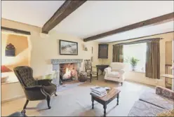  ??  ?? The cottage has been renovated and now boasts three bedrooms and two attic rooms. Dame Josephine, above left, has furnished with sale room finds from Andrew Hartley in Ilkley and she has created a fireplace in the sitting room using a carved lintel...