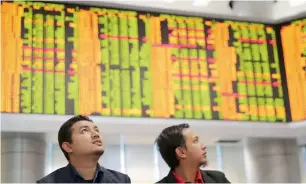  ?? AP ?? MSCI’s broadest index of Asia-Pacific shares outside Japan ticked up 0.1 per cent on Thursday. —