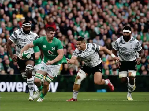  ?? (Getty) ?? Nick Timoney powers his way towards a try in Dub l in l ast night