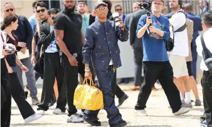  ?? Jacopo Raule/Getty Images ?? Pharrell Williams, Louis Vuitton’s creative director, was spotted carrying the bag at Paris fashion week over the summer. Photograph: