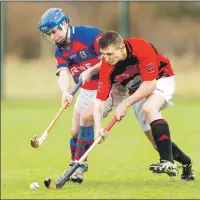  ?? Photograph: Neil Paterson. ?? Glenurquha­rt’s Fraser Heath and Kingussie’s James Falconer in action durling last weekend’s Marine Harvest Premiershi­p match.