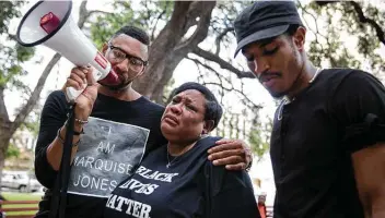  ?? Staff file photo ?? Deborah Bush, Marquise Jones’ aunt, cries while Mike Lowe, left, and Johnathan-david Jones speak at a rally organized by Black Lives Matter in 2016. Jones was killed by an off-duty San Antonio officer in 2014.