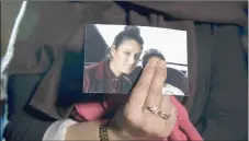  ?? — AFP file photo ?? Renu, eldest sister of Shamima Begum, holds a picture of her sister while being interviewe­d by the media in central London.