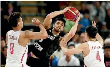  ?? GETTY IMAGES ?? Tall Black Shea Ili feels the strain of close attention from Zhao Rui and Zhao Jiwei during the win over China in Auckland.