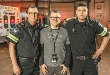  ??  ?? Tony Hrynchuk, centre, director of the series Paramedics: Emergency Response, is shown with Saskatoon paramedics Brett Hart, left, and Ben Deutscher.