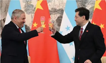  ?? Photograph: Greg Baker/AP ?? Honduras foreign minister Eduardo Enrique Reina Garcia, left, and Chinese foreign minister Qin Gang raise a toast following the establishm­ent of diplomatic relations between the two countries,