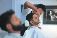  ?? AAMIR QURESHI / AGENCE FRANCE-PRESSE ?? A customer gets a haircut at the ‘Men’s’ salon in Islamabad, Pakistan. The country has seen an increase in male beauty regimes.