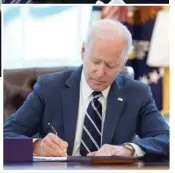  ??  ?? ABOVE: President Joe Biden signs the American Rescue Plan on Thursday in the Oval Office.