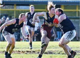  ??  ?? Warragul Industrial­s player River Ford breaks clear from his Catani opponent.