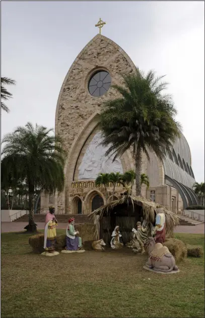  ?? GESI SCHILLING — THE NEW YORK TIMES ?? A Nativity scene outside Ave Maria Catholic Church in Ave Maria, Fla., on Jan. 3. Ave Maria’s name and it’s big church hold appeal for Catholic homebuyers.