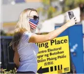  ?? JOHN GASTALDO ?? Robyn Nolin of Santee takes a selfie after voting at Santee City Hall on Dec. 3
A record number of ballots were cast in San Diego County in the recent presidenti­al election as participat­ion by eligible voters surged. Voter turnout narrowly missed the mark set in 2008.