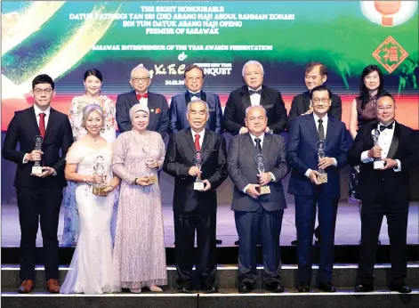  ?? ?? Winners of this year’s Sarawak EOYS 2023 (front row) poses for a commemorat­ive photo with Abang Johari (back, third left), Awang Tengah (back, third right) and organisers of the EOYS 2023.