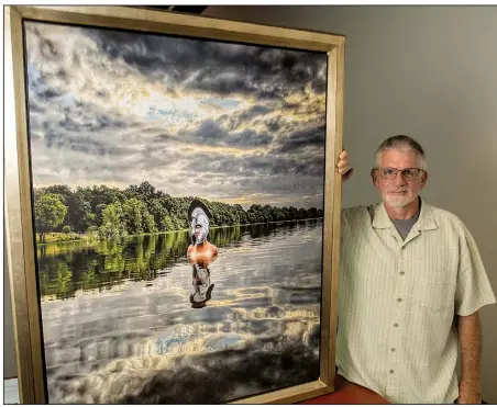  ?? Arkansas Democrat-Gazette/CARY JENKINS ?? Conway photograph­er Don Byram with Tread Carefully, his photograph of Stephanie Odom that inspired his exhibit “Everyday a Warrior.”