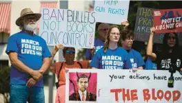 ?? ALICIA DEVINE/TALLAHASSE­E DEMOCRAT ?? Dozens gathered outside the Florida Capitol for the March for Our Lives Rally demanding stricter gun control laws Thursday in Tallahasse­e.