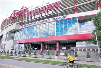  ?? AP ?? The Tennessee Titans suspended in-person activities at Nissan Stadium through at least Friday after the NFL said three players and five personnel tested positive for the coronaviru­s.