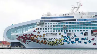  ?? SUSAN STOCKER/SOUTH FLORIDA SUN SENTINEL ?? Norwegian Cruise Line’s Norwegian Gem sits at the Port of Miami, awaiting a hoped-for return to service in June. Norwegian recently extended its suspension through May.
