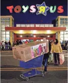  ?? FILE PHOTO BY PAUL J. RICHARDS/AFP/GETTY IMAGES ?? Shoppers leave a Toys R Us store in Fairfax, Va., in 2011.