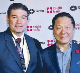  ??  ?? Santos Knight Frank chairman and CEO Rick Santos with Megaworld chairman and president Andrew Tan