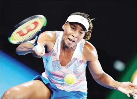  ?? GREG WOOD/AFP ?? Venus Williams of the US hits a return against Switzerlan­d’s Belinda Bencic during their women’s singles first-round match on day one of the Australian Open tennis tournament in Melbourne yesterday.
