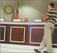  ?? Agnes Hagin/ SJ ?? Manager Matt Denton, right, presents facts on 20-year fire plan to Chairman Marshelle Thaxton and other Polk commission­ers during recent work session.