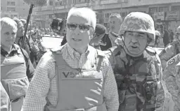  ?? AP ?? Below: McCain visits the popular Shorja market in central Baghdad, Iraq, on April 1, 2007. Later that month, the senator announced he was running for president and later received the Republican Party’s nomination.