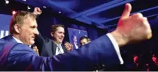  ?? FRANK GUNN/THE CANADIAN PRESS ?? Andrew Scheer, centre, is congratula­ted by Maxime Bernier.