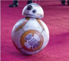  ?? JORDAN STRAUSS/INVISION/THE ASSOCIATED PRESS ?? The Force Awakens’ rolling sidekick BB-8 is already a hit with fans.