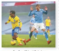  ??  ?? Percy Tau and Oleksandr Zinchenko.