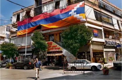  ?? HUSSEIN MALLA/ASSOCIATED PRESS ?? A giant flag of the Nagorno-Karabakh region hung on a building in the main Armenian district of the northern Beirut suburb of Bourj Hammoud, Lebanon, on Monday.