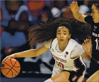  ?? ELSA — GETTY IMAGES ?? Stanford’s Haley Jones (30), of Santa Cruz, drives against South Carolina’s Brea Beal (12) during the fourth quarter of their Final Four semifinal on Friday at the Alamodome in San Antonio, Texas. Stanford will play Arizona for the national championsh­ip on Sunday.