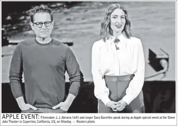  ??  ?? Filmmaker J. J. Abrams (left) and singer Sara Bareilles speak during an Apple special event at the Steve Jobs Theater in Cupertino, California, US, on Monday. — Reuters photo