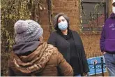  ?? EMILY LESHNER AP ?? Sofia Moncayo leads a food distributi­on program through Mosaic West Queens Church in New York.