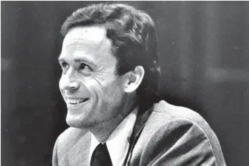  ?? Associated Press ?? ■ In this June 27, 1979, file photo, Ted Bundy smiles during the second day of jury selection for his murder trial in a Dade County courtroom in Miami, Fla.