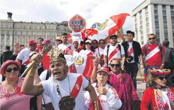  ??  ?? Peru fans have a reason to rejoice at Red Square in Moscow with their national team making a first appearance at the World Cup finals in 36 years