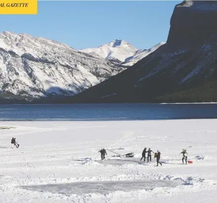  ?? MARIE CONBOY / POSTMEDIA NEWS ?? Skaters enjoy a sunny day on Lake Minnewanka in Banff National Park on Jan. 13, a popular spot where, a week later, four other people fell through the ice. All survived, but officials are warning Canadians looking for some fresh air to be prepared for sometimes dangerous conditions.