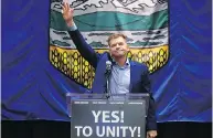  ?? DAVID BLOOM / POSTMEDIA NEWS FILES ?? Brian Jean waves to the crowd after the Wildrose party voted to unite with the Progressiv­e Conservati­ves in 2017.