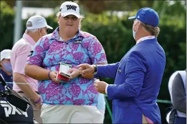  ?? (AP/Chris O’Meara) ?? Haley Moore (left) talks to the starter on the first hole before the first round at last week’s LPGA Pelican Women’s Championsh­ip in Belleair, Fla. Moore, a 22-year-old rookie, has struggled with weight issues and self-esteem for much of her life but it didn’t stop her from achieving her goal of playing on the LPGA Tour.