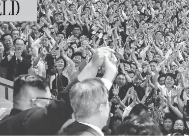  ?? PYONGYANG PRESS CORPS / POOL / GETTY IMAGES ?? North Korean leader Kim Jong Un, left, and South Korean President Moon Jae-in, right, acknowledg­e a crowd in Pyongyang, Wednesday. Kim and Moon are holding talks on the denucleari­zation of the Korean Peninsula.