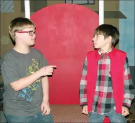  ?? CAROL ROLF/CONTRIBUTI­NG PHOTOGRAPH­ER ?? Edward, played by Colby Wilson, left, confronts Tom Canty, the street urchin, played by Hayden Woods, in this scene from The Prince and the Pauper.