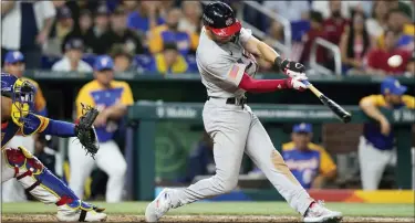  ?? WILFREDO LEE — THE ASSOCIATED PRESS ?? United States’ Trea Turner of the Philadelph­ia Phillies hits a go-ahead grand slam during the eighth inning of a World Baseball Classic quarterfin­al game against Venezuela on Saturday in Miami. The blast gave the US a 9-7victory.